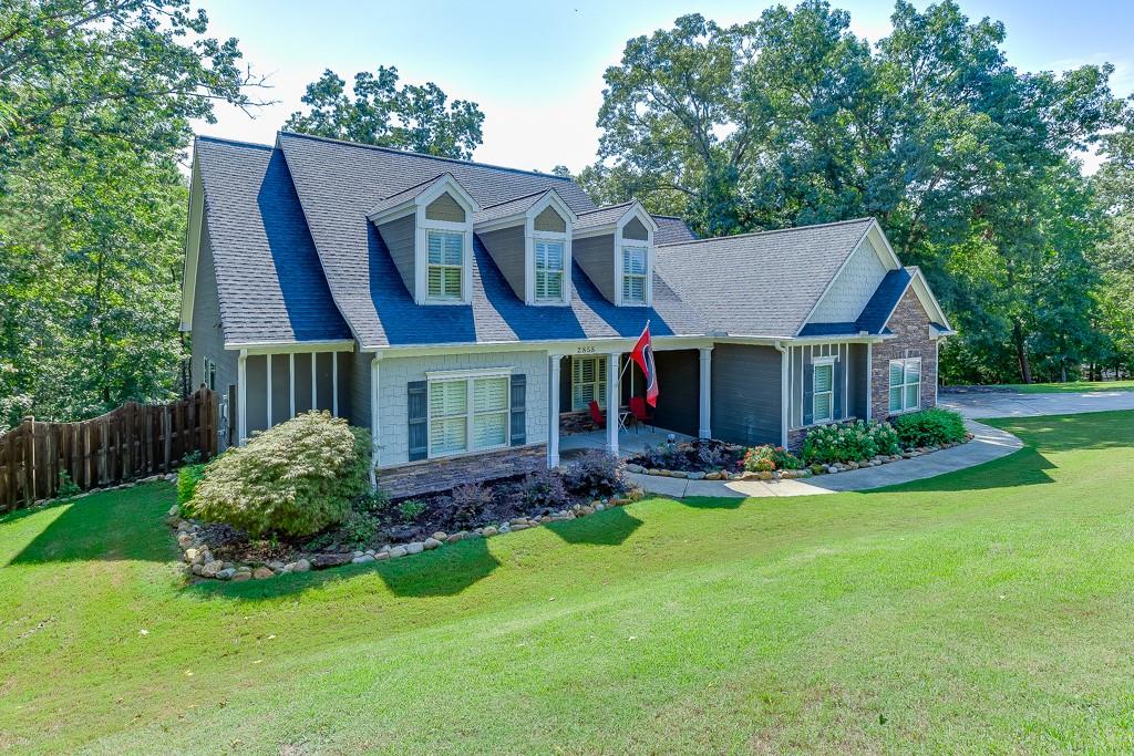 2858 Shadowstone Way Winder, GA 30680 - Photo 3 of 52 a view of a house with a yard and sitting area