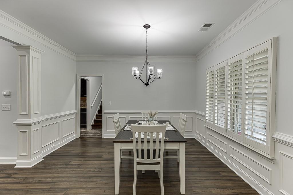 2858 Shadowstone Way Winder, GA 30680 - Photo 5 of 52 a view of a dining room with furniture window and wooden floor