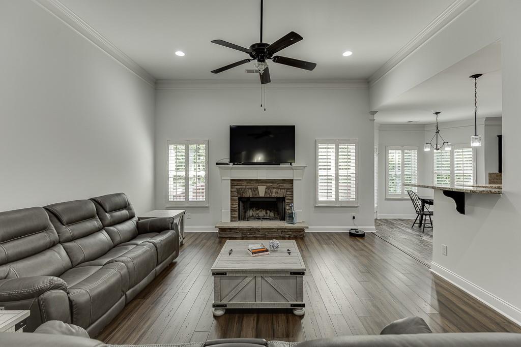 2858 Shadowstone Way Winder, GA 30680 - Photo 9 of 52 a living room with furniture and a fireplace