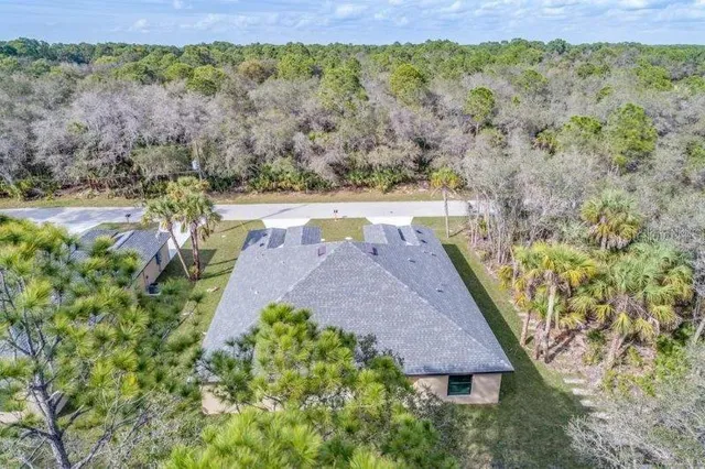 a view of a yard in front of the house with a yard