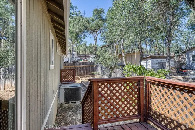 a view of balcony with wooden floor