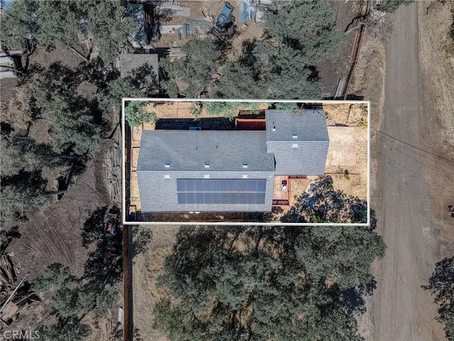 an aerial view of residential house with outdoor space