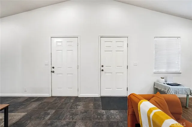 a bedroom with bed and window