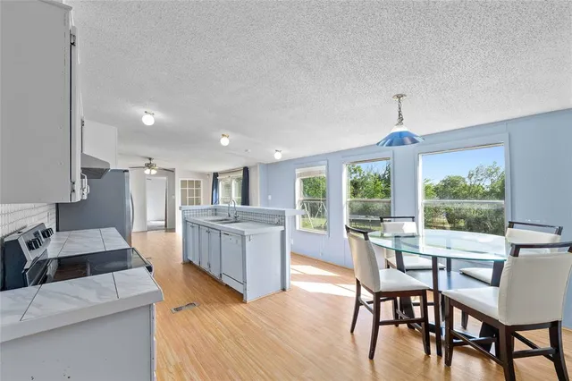a view of a dining room with furniture window and outside view