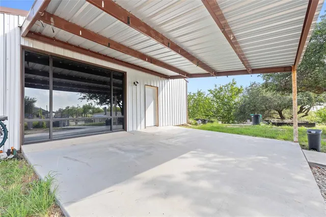 a view of a porch and garden
