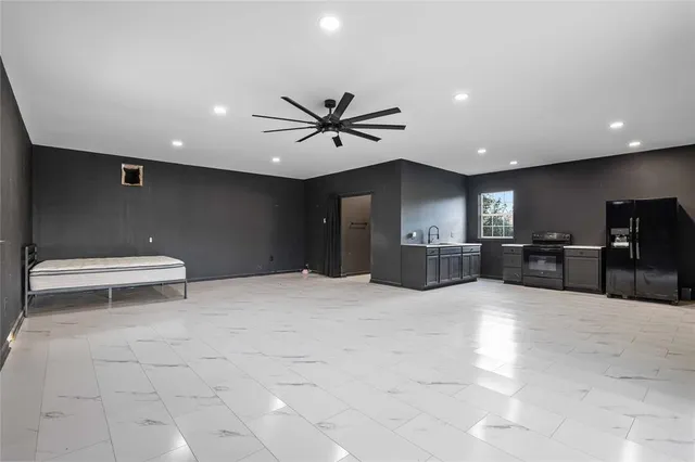 a view of a kitchen with a sink and a toilet