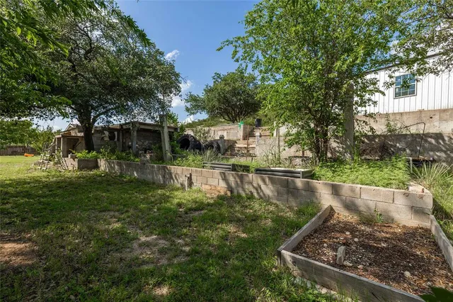 a view of a swimming pool with a garden