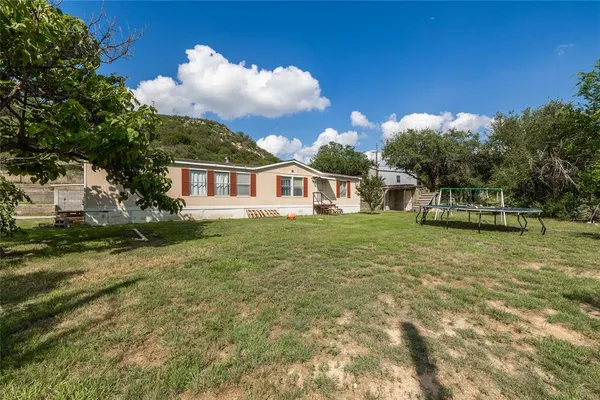 a view of a balcony with wooden floor