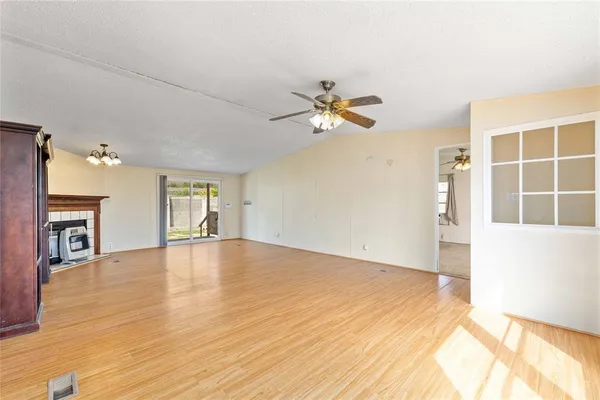 a kitchen with stainless steel appliances a refrigerator sink and white cabinets