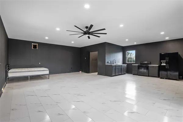 a view of a kitchen with a sink and a toilet