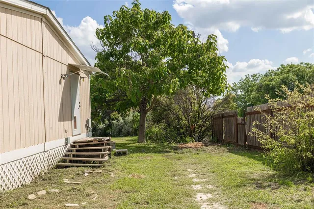 a view of a back yard of the house
