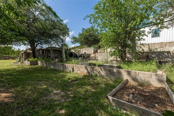 a view of a swimming pool with a garden