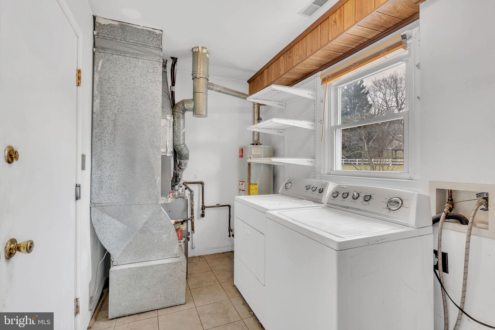 9104 Trumps Hill Road Upper Marlboro, MD 20772 - Photo 12 of 25 a utility room with dryer and washer