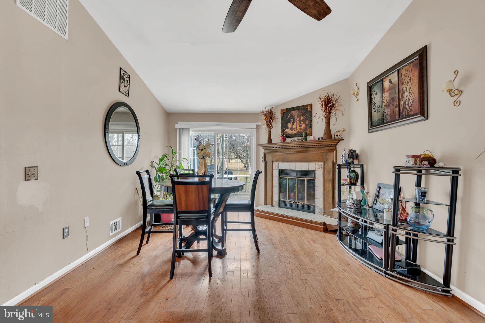 9104 Trumps Hill Road Upper Marlboro, MD 20772 - Photo 13 of 25 a view of a livingroom with furniture and a fireplace