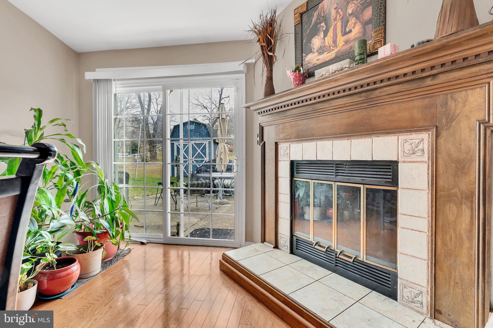 9104 Trumps Hill Road Upper Marlboro, MD 20772 - Photo 14 of 25 a view of a balcony with floor to ceiling window and potted plants