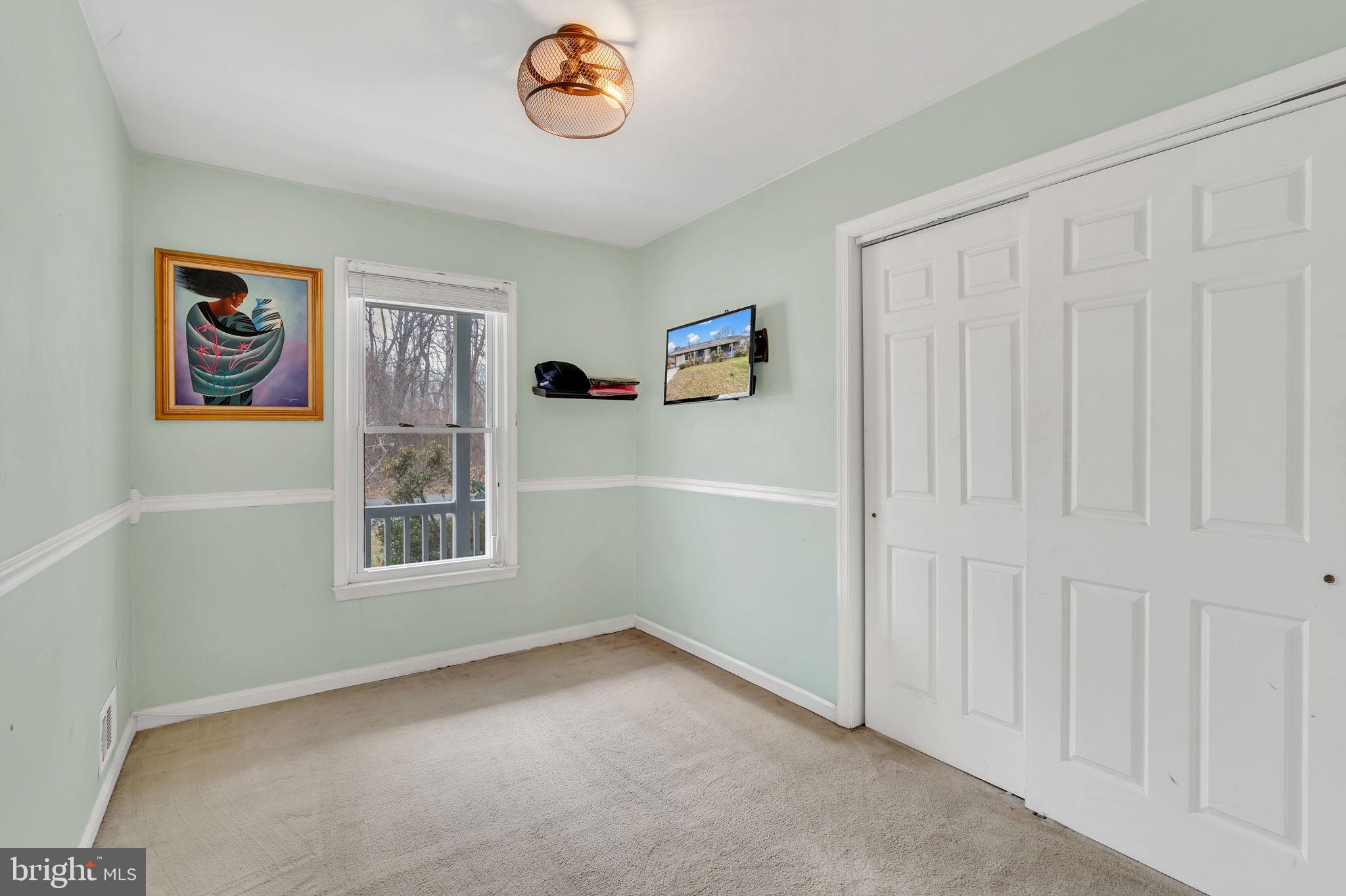9104 Trumps Hill Road Upper Marlboro, MD 20772 - Photo 15 of 25 an empty room with windows and closet