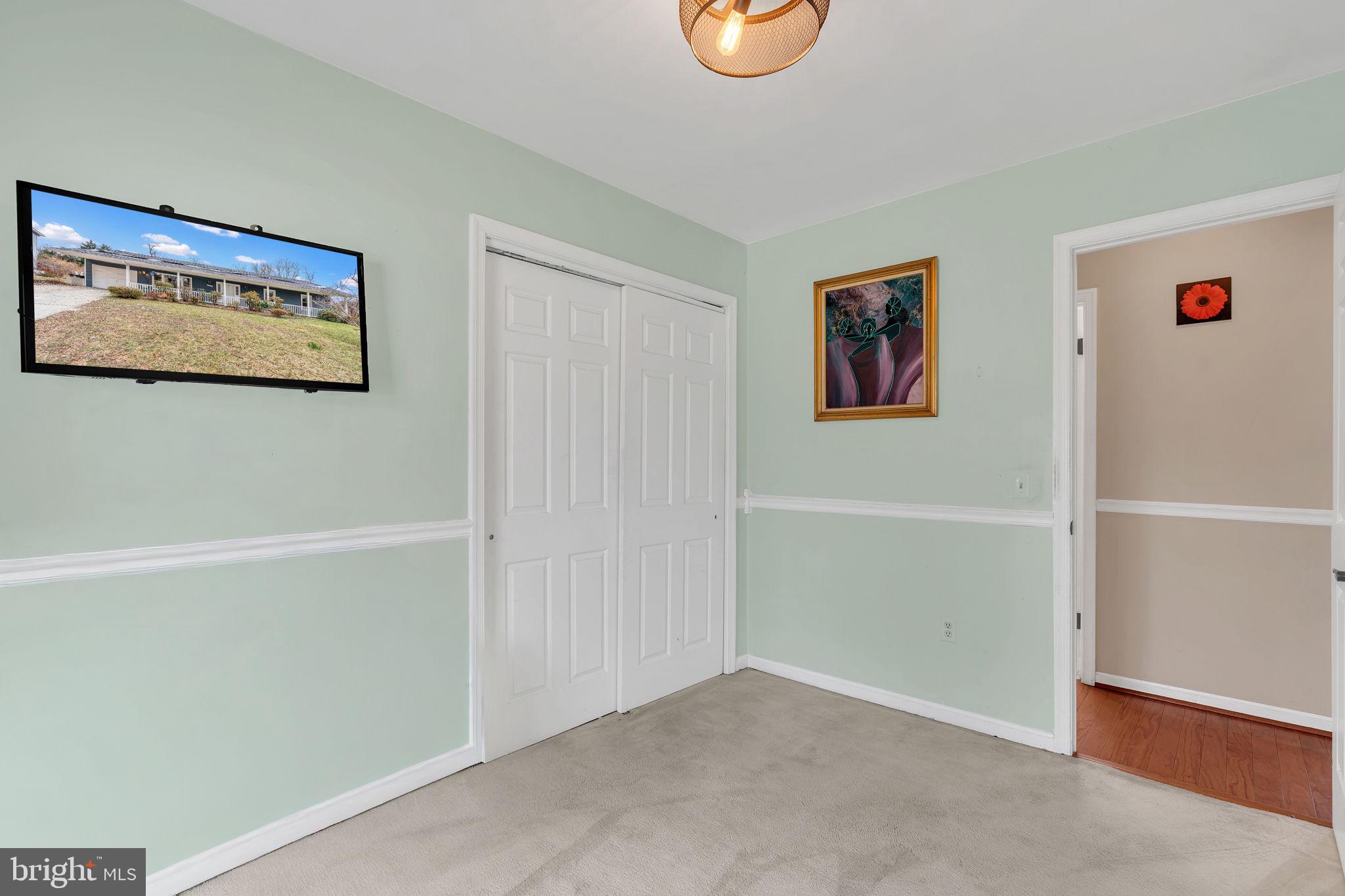 9104 Trumps Hill Road Upper Marlboro, MD 20772 - Photo 16 of 25 a view of a hallway with workspace