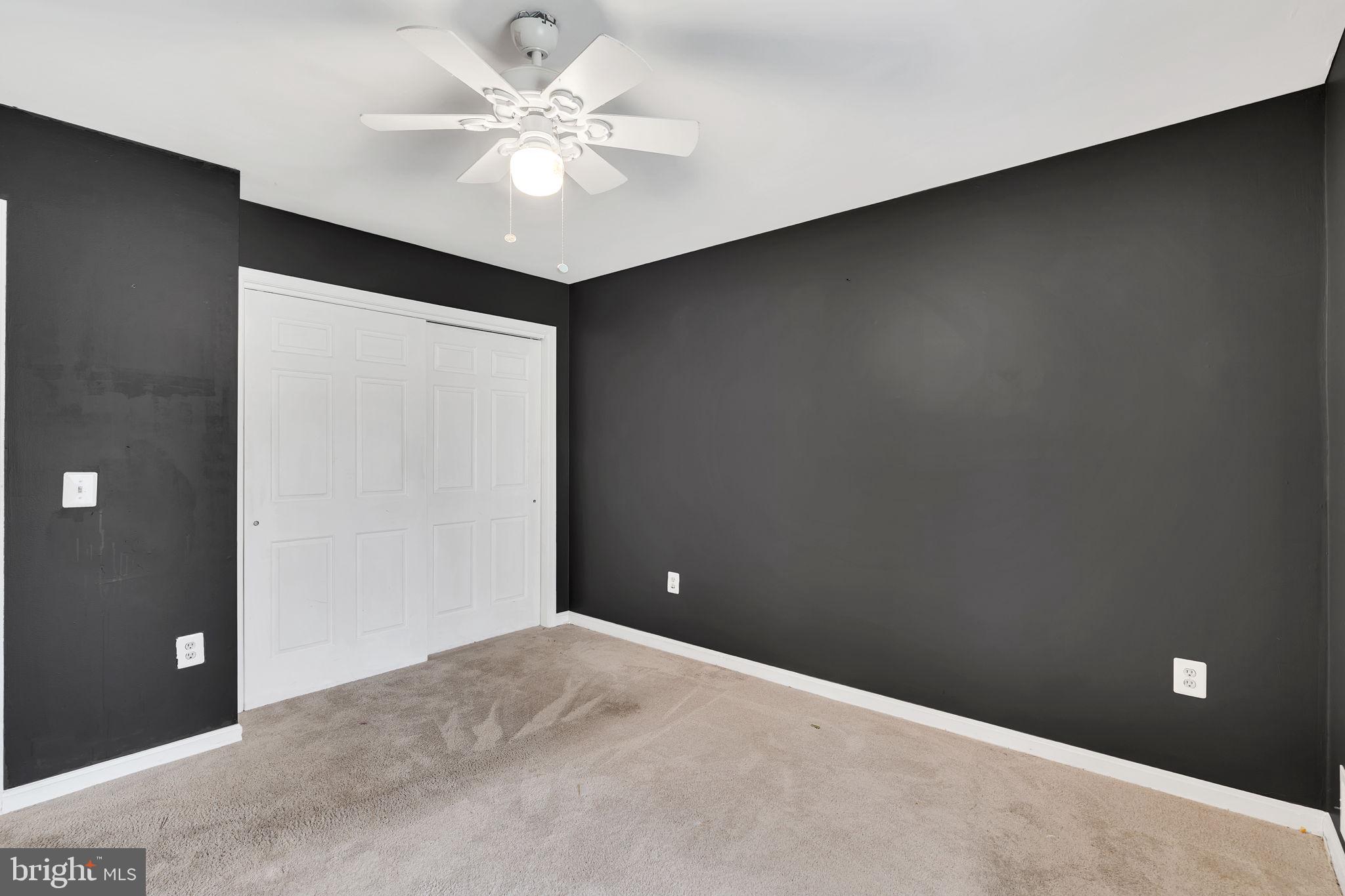 9104 Trumps Hill Road Upper Marlboro, MD 20772 - Photo 18 of 25 a view of a big room with a ceiling fan and a chandelier fan