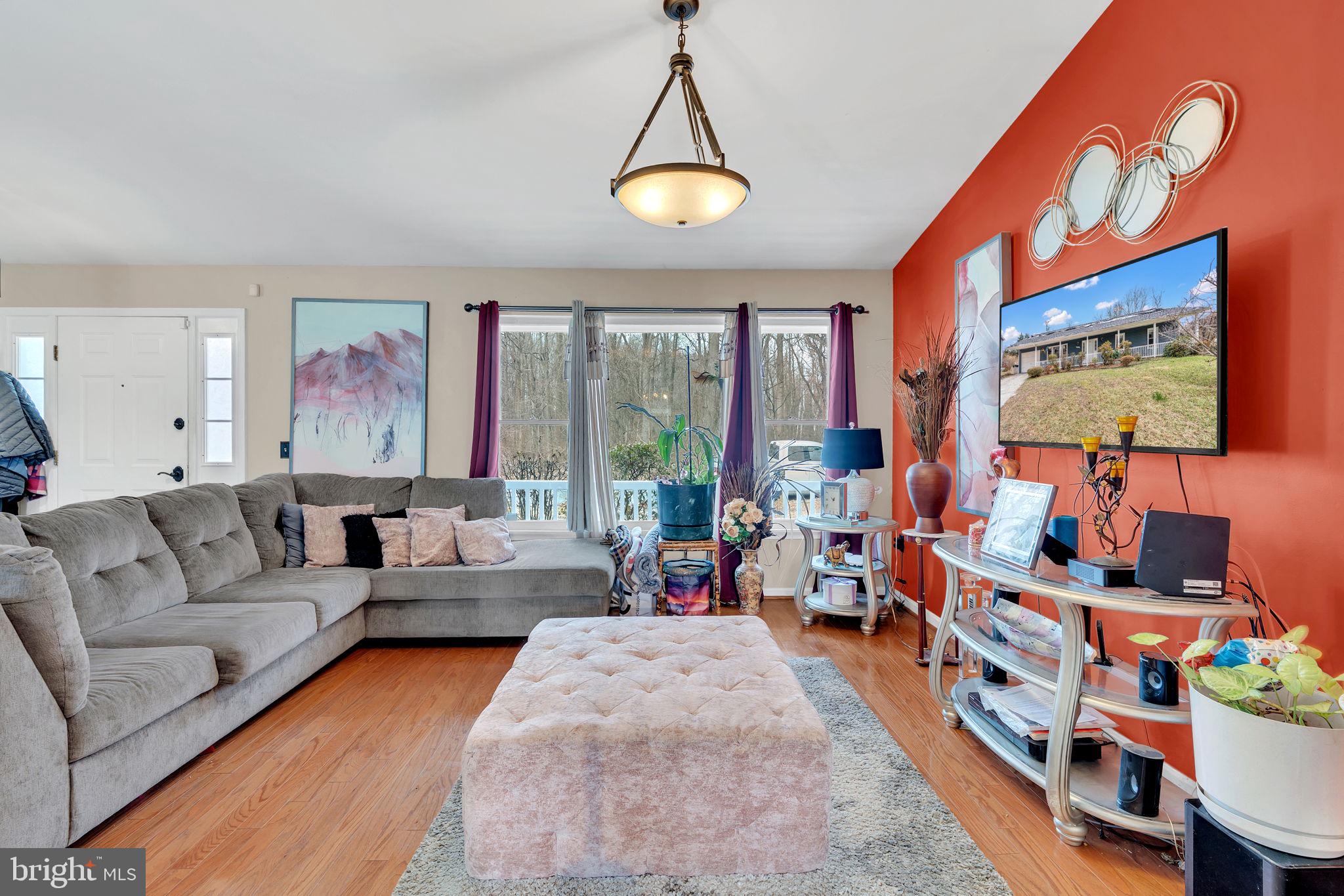9104 Trumps Hill Road Upper Marlboro, MD 20772 - Photo 6 of 25 a living room with furniture and a flat screen tv