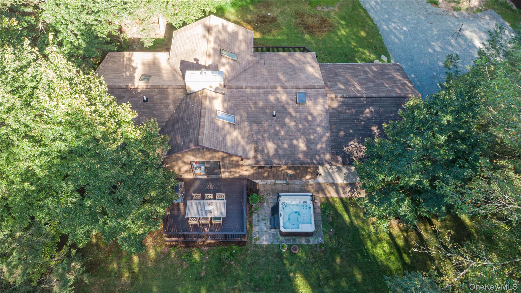 15 Deer Meadow Road Bethel, NY 12786 - Photo 12 of 40 a aerial view of a house with a yard and large trees