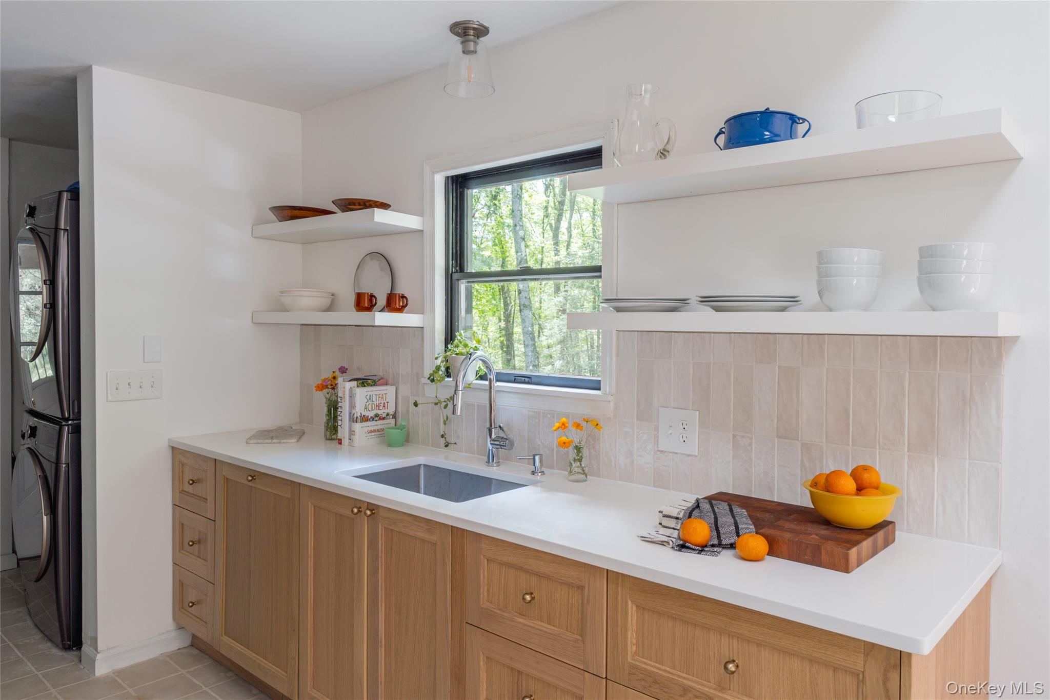 15 Deer Meadow Road Bethel, NY 12786 - Photo 13 of 40 a kitchen with a sink a stove and cabinets