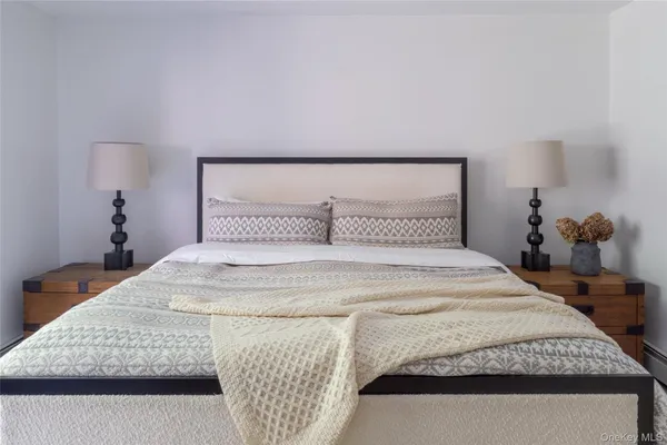 a bedroom with a bed and dresser