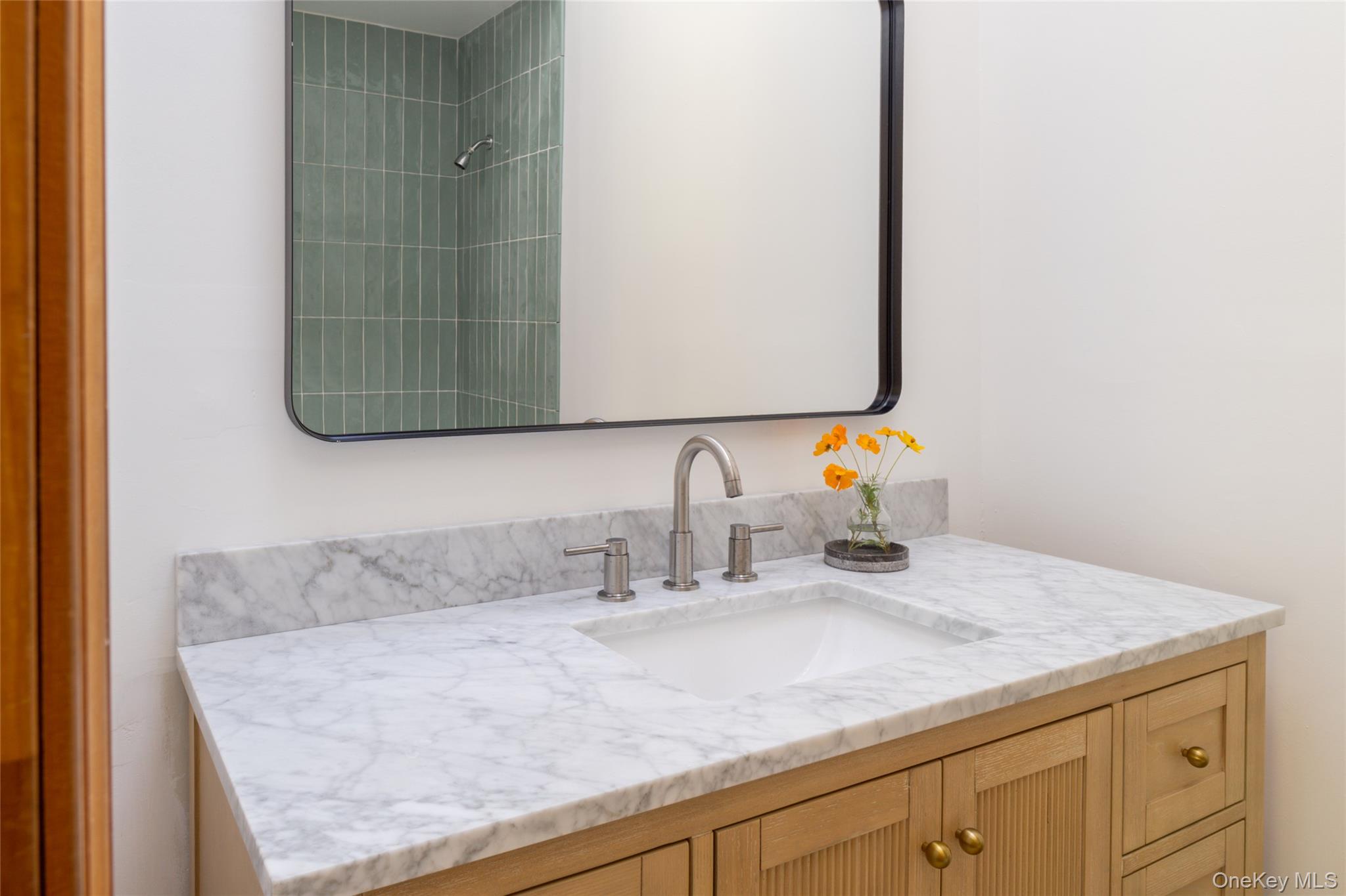 15 Deer Meadow Road Bethel, NY 12786 - Photo 23 of 40 a bathroom with a granite countertop sink and a mirror