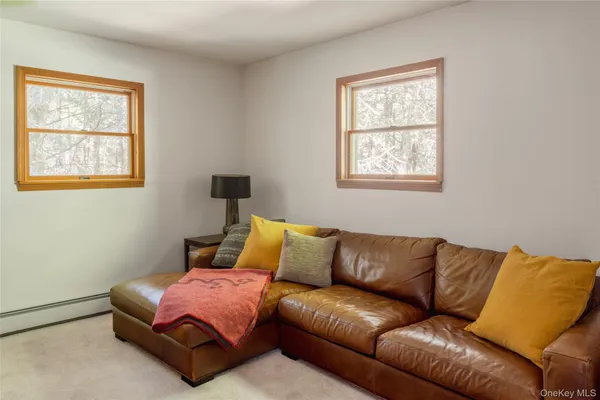 a blue couch sitting in a living room with a couch