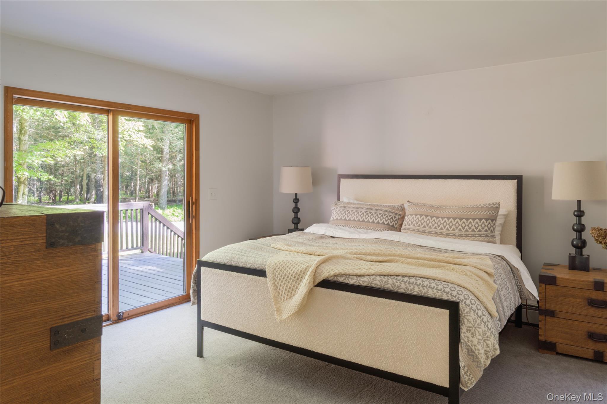 15 Deer Meadow Road Bethel, NY 12786 - Photo 6 of 40 a bedroom with a bed and a large window