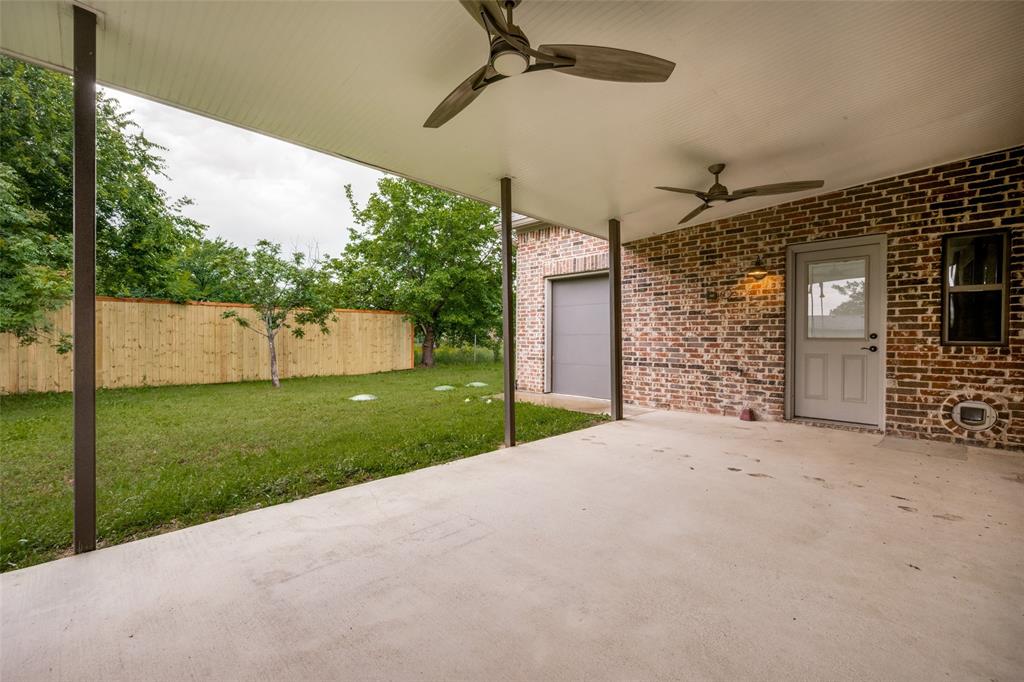 444 Ben Boyd Road Argyle, TX 76226 - Photo 25 of 28 a view of a house with a yard and garage