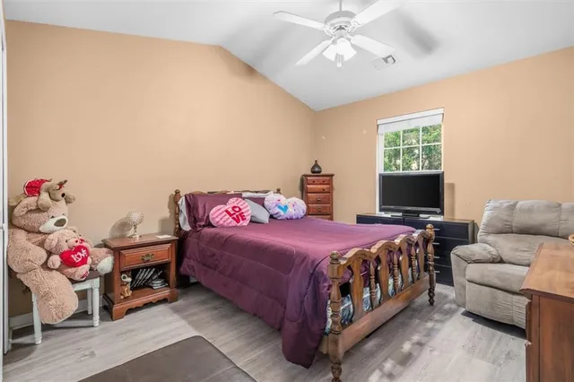 a bedroom with a bed and a couch