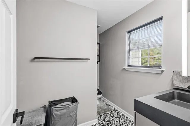 a kitchen with a refrigerator and a sink