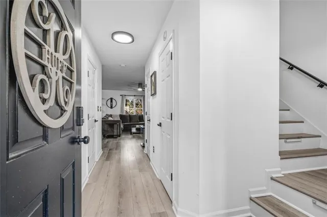 a view of a hallway with washer and dryer