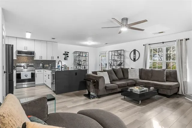 a living room with a couch and a window