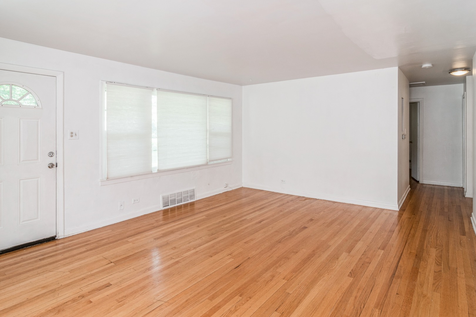 609 North County Line Road Hinsdale, IL 60521 - Photo 3 of 12 wooden floor in an empty room with a window