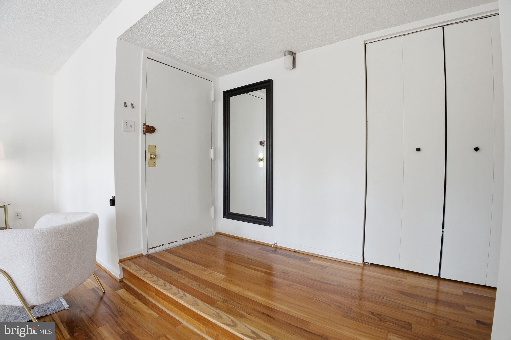 11805 Breton Court, Unit 1A Reston, VA 20191 - Photo 4 of 25 Entryway with coat closet