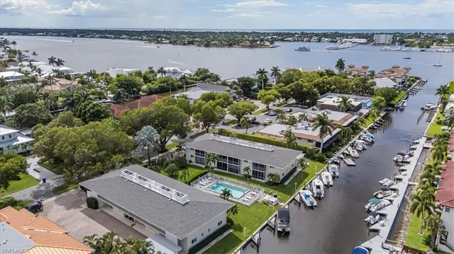 an aerial view of a residential apartment building with a yard