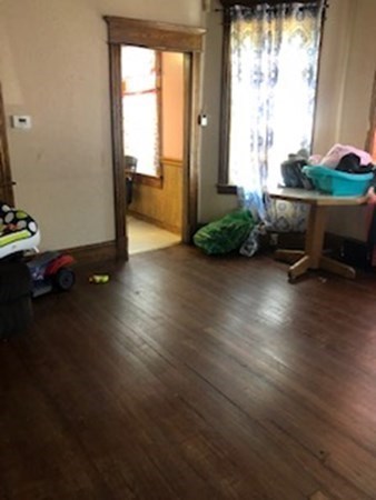 657 Carew Street Springfield, MA 01104 - Photo 4 of 21 a room with furniture and a window