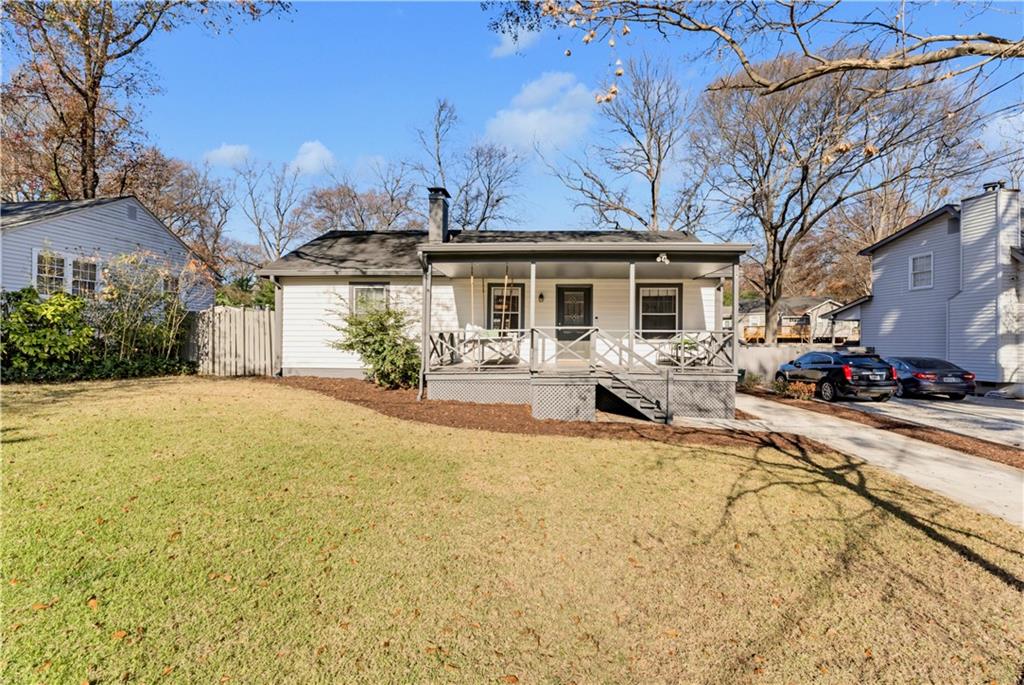 a view of a house with pool and chairs