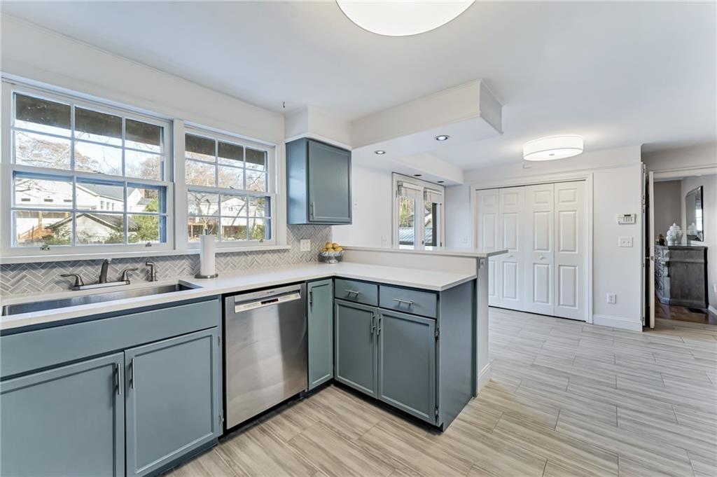777 Forrest Street Northwest Atlanta, GA 30318 - Photo 16 of 35 a kitchen with a sink cabinets and wooden floor