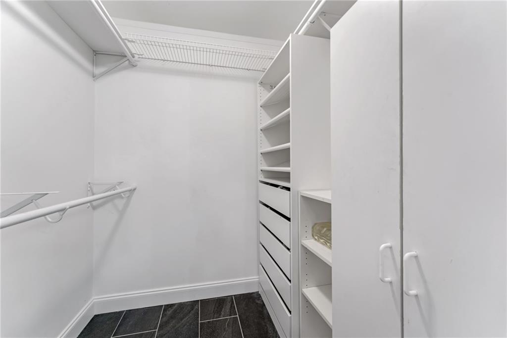 777 Forrest Street Northwest Atlanta, GA 30318 - Photo 21 of 35 a view of walk in closet with empty racks
