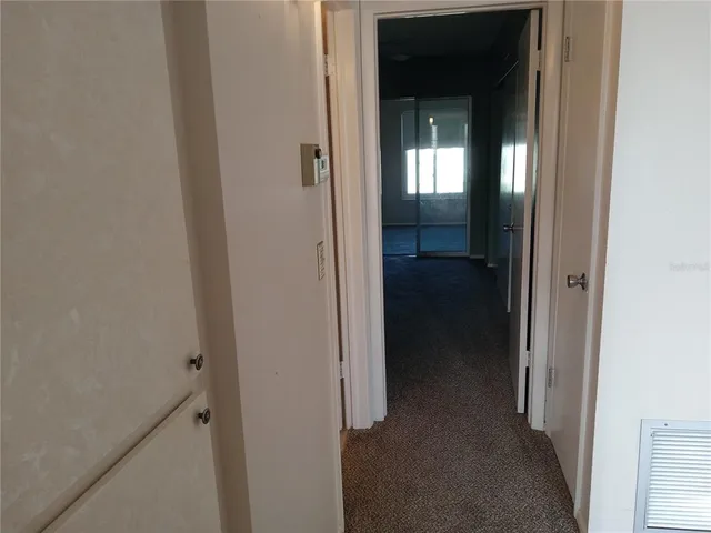 a view of a livingroom from a hallway