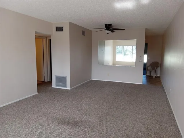 an empty room that has a window