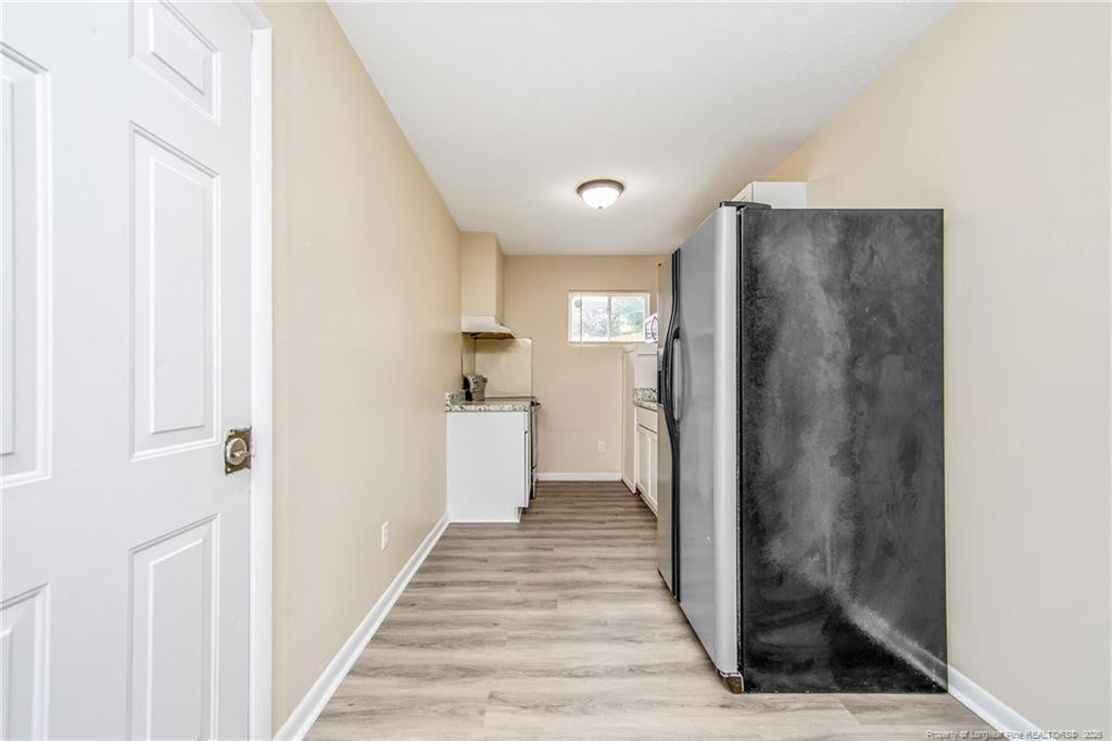 4305 Rosehill Road, Unit C Fayetteville, NC 28311 - Photo 3 of 7 a view of a hallway with wooden floor