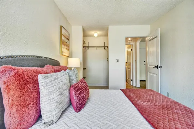 a bedroom with a bed and a couch