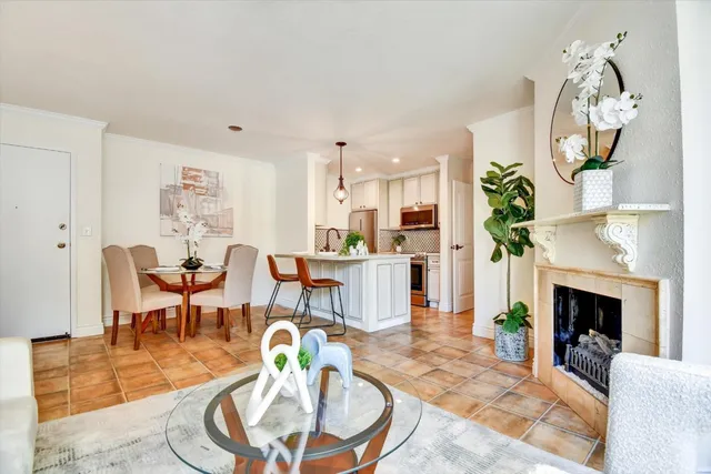 a living room with fireplace furniture and a fireplace