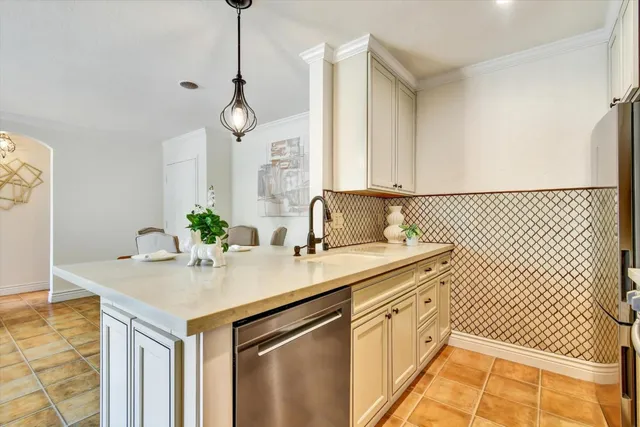 a kitchen with sink cabinets and wooden floor