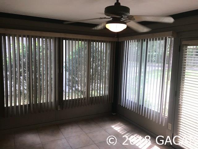 1105 Southwest 75 Way Gainesville, FL 32607 - Photo 10 of 23 Front porch was closed in to create beautiful sunroom