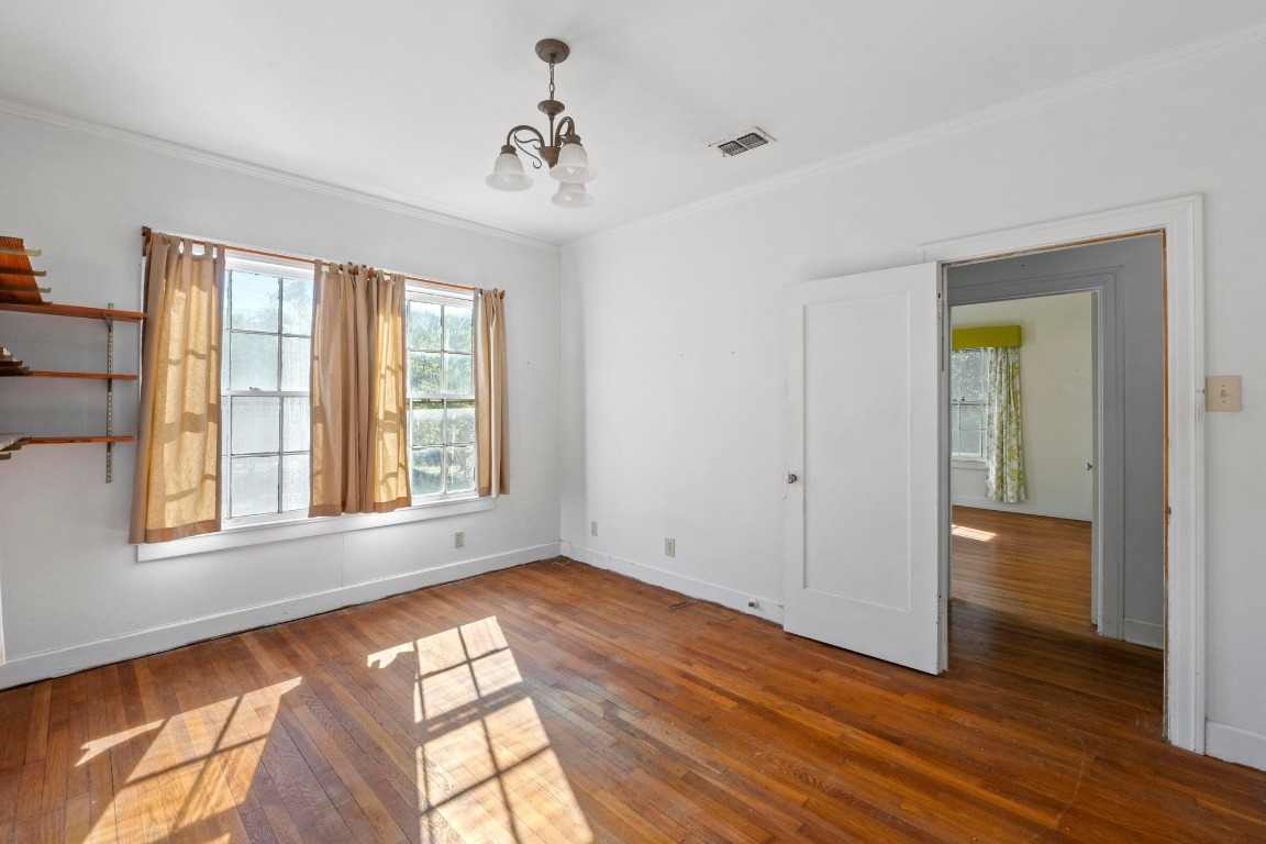 810 East 45th Street Austin, TX 78751 - Photo 16 of 25 a view of empty room with wooden floor and fan