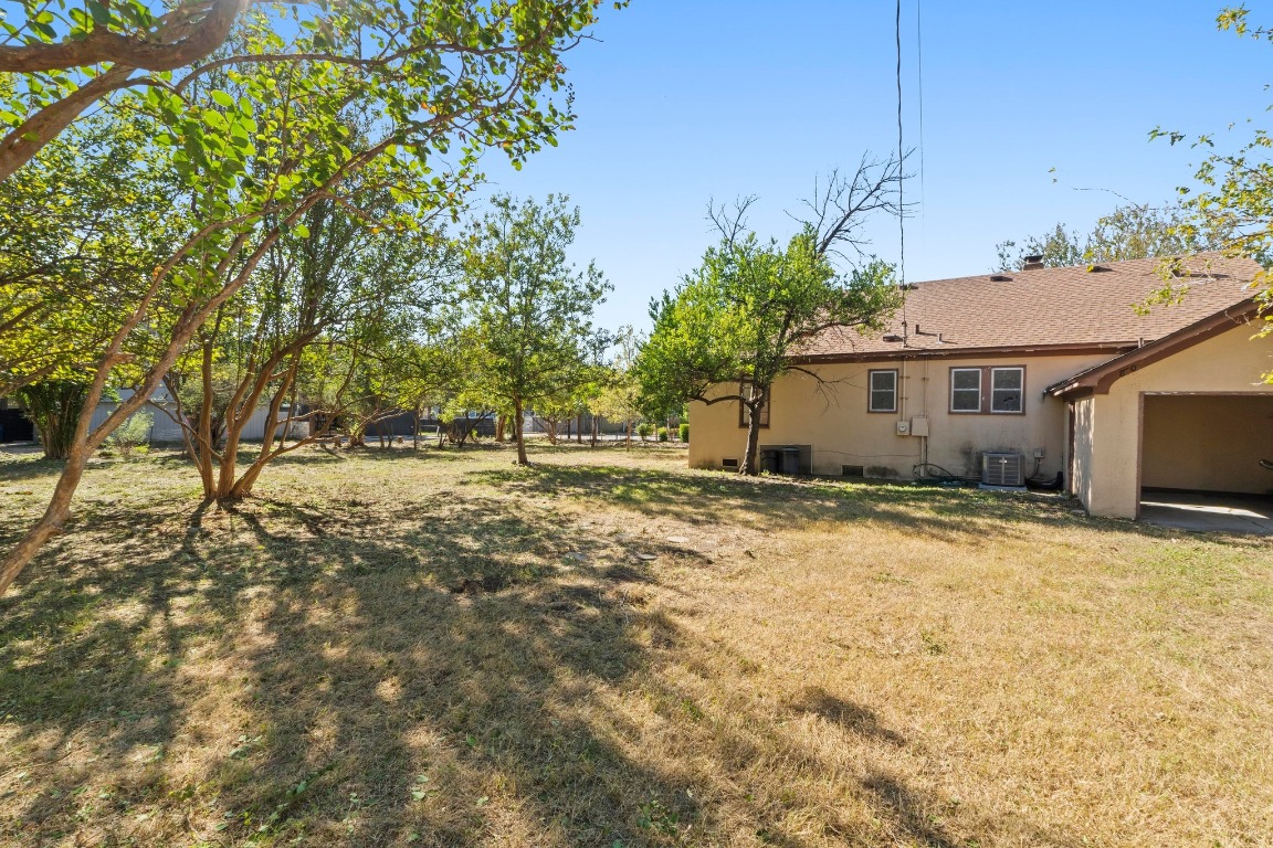 810 East 45th Street Austin, TX 78751 - Photo 25 of 25 a view of garage yard and tree